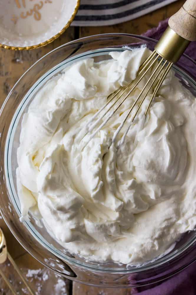 Heavy cream beaten to stiff peaks for homemade whipped cream