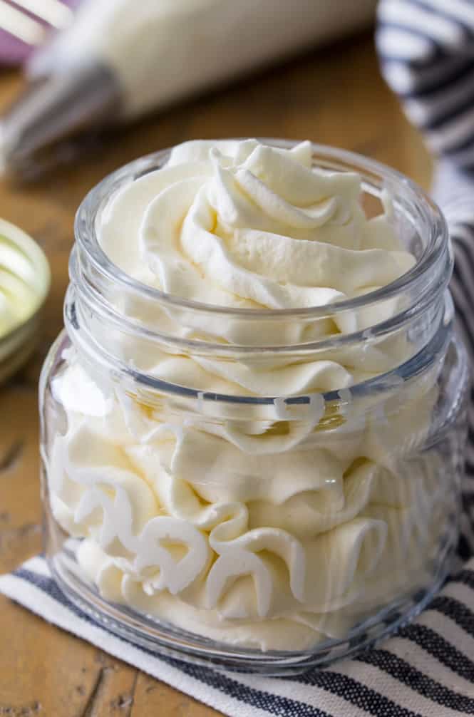 Homemade whipped cream piped into a glass jar